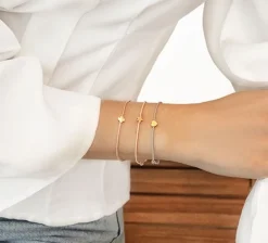 Bransoletka z pozłacaną gwiazdką Etincelle na grubym złotym sznurku premium^Lilou Fashion